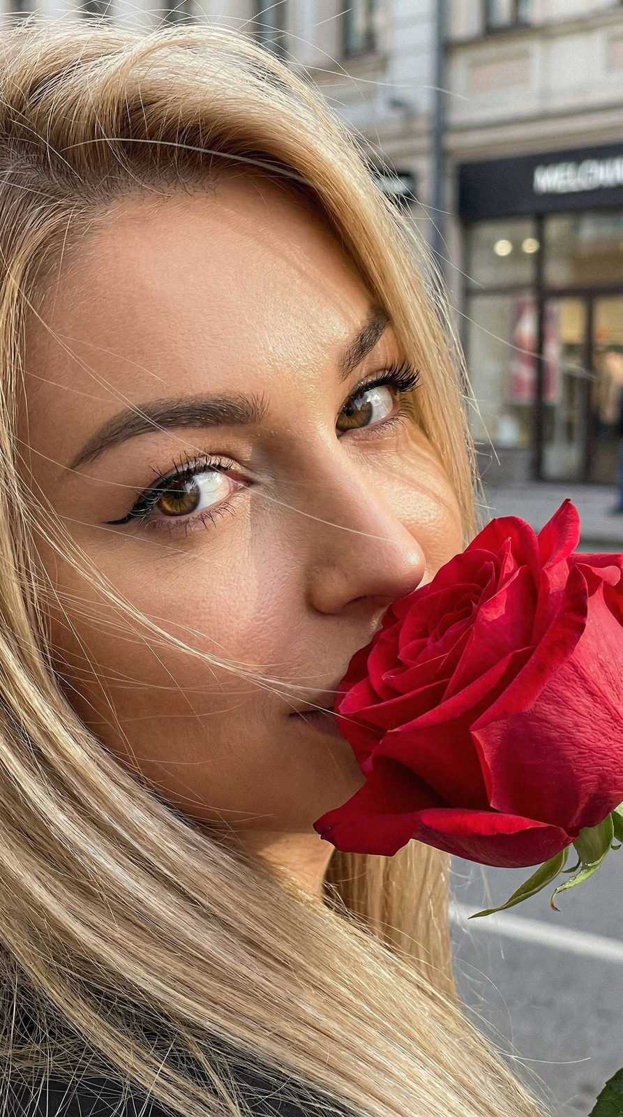 Close-Up Portrait with Red Rose at Sunset