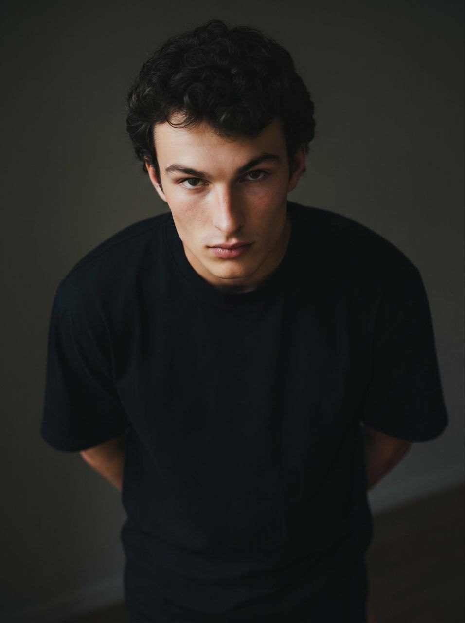 Cinematic Portrait of Man in Moody Minimalist Setting