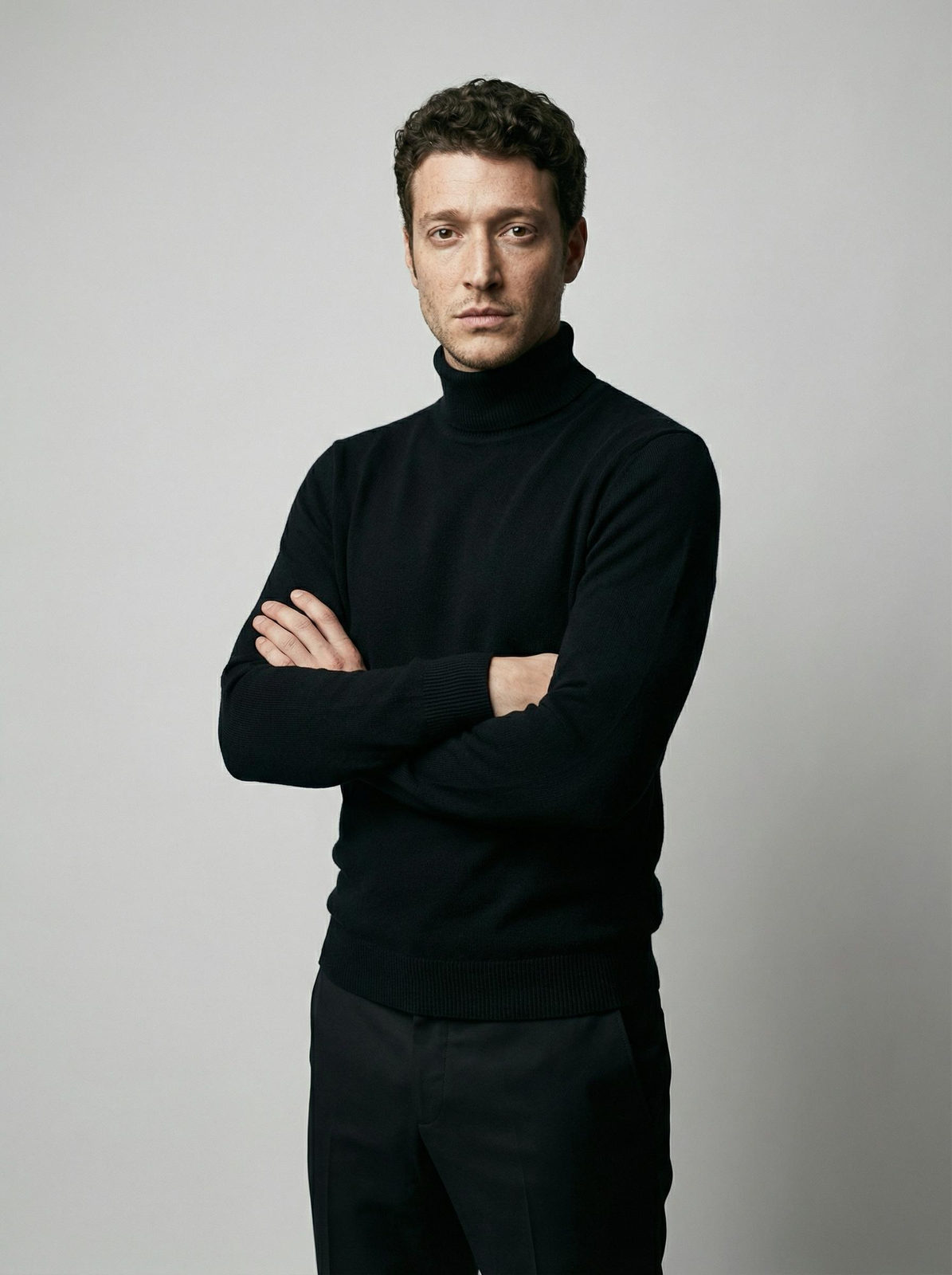 Confident Man in Black Turtleneck Studio Portrait