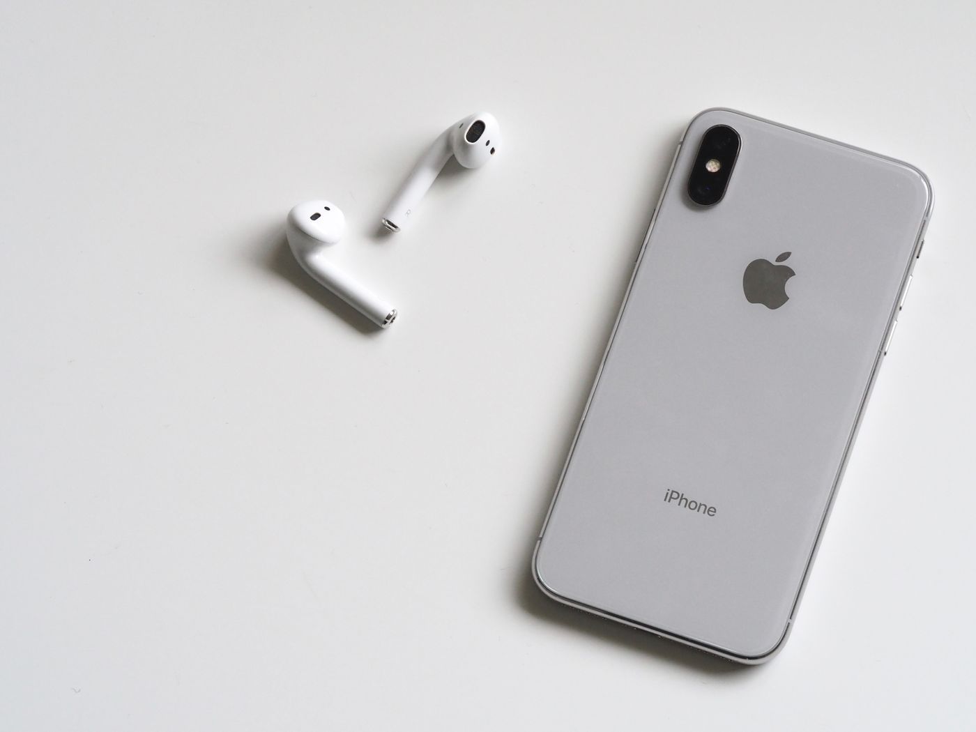 Hand holding smartphone photographing product for ecommerce reference