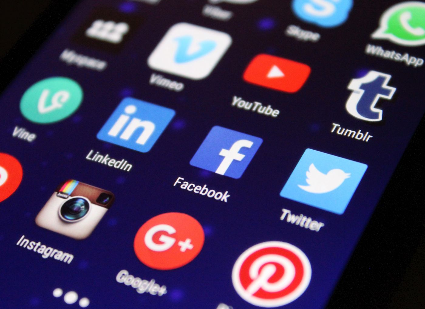 Smartphone with social app icons representing multi-channel ecommerce asset formats