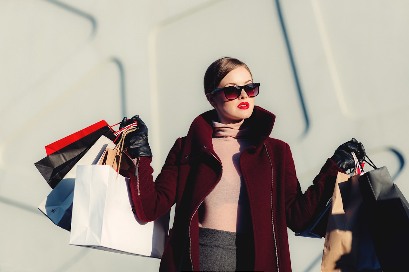 Woman in fashion apparel on city street — lifestyle commute context