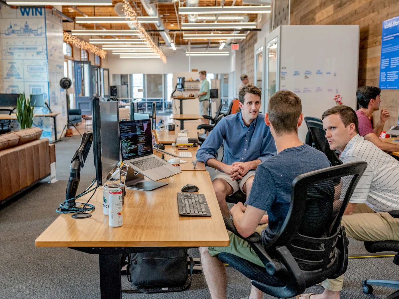 Small team collaborating on creative workflow in modern office